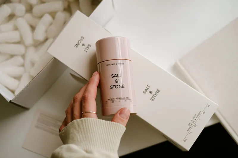 Elegant skincare packaging showcasing Salt & Stone deodorant with a cozy, minimal aesthetic
