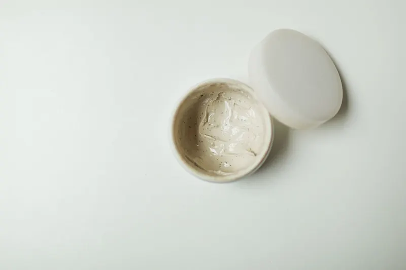 Close-up of an opened cream jar, ideal for skincare product representation